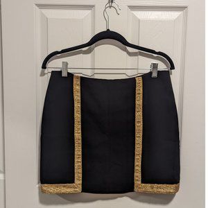 black skirt with gold details